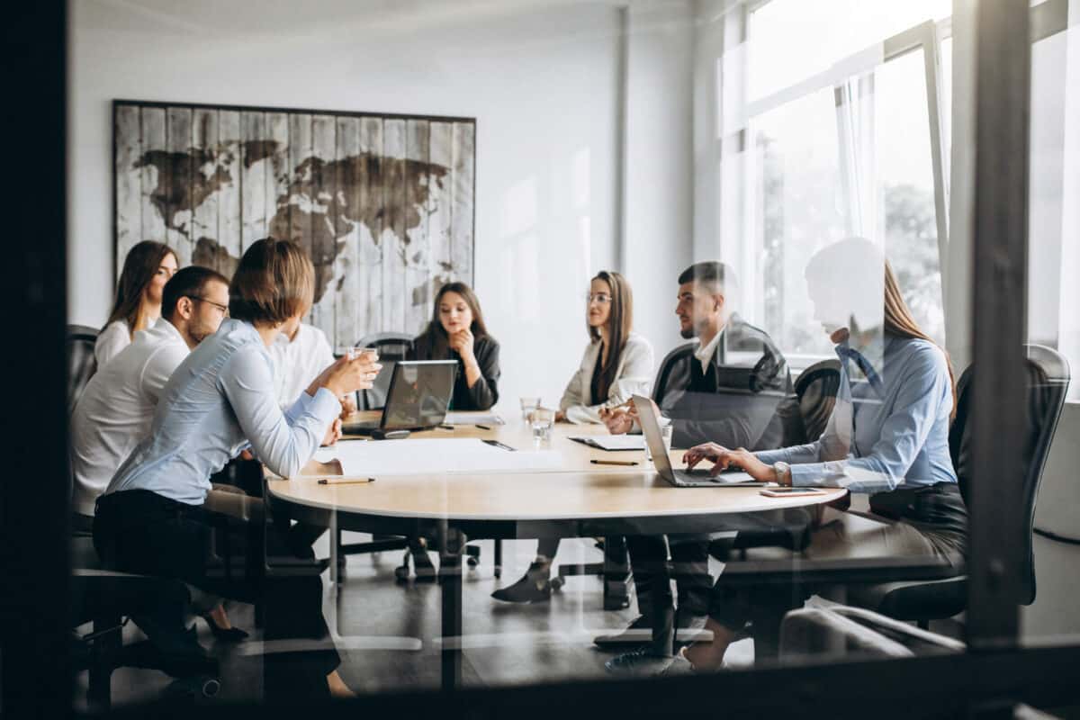 group people working out business plan office scaled e1688579881181